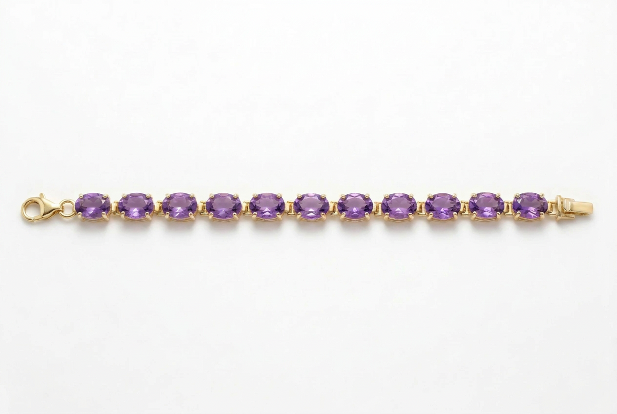 A yellow gold tennis bracelet featuring a row of round-cut purple amethyst gemstones, displayed horizontally on a clean white background.